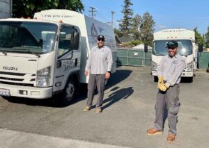 Plumbers standing next to their service vehicle in Sonoma, California.